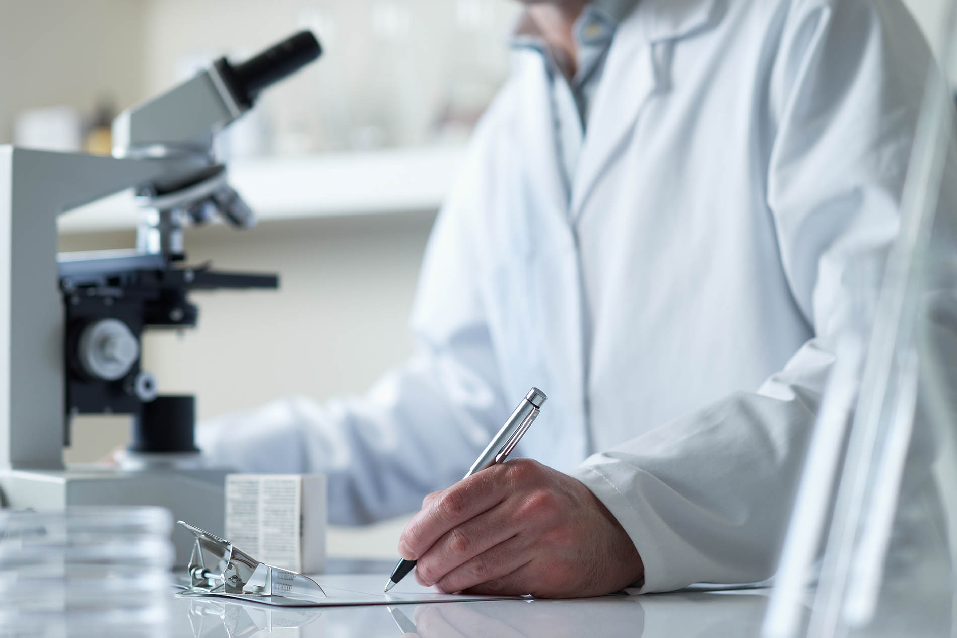 scientist conducting research with microscope meth testing news